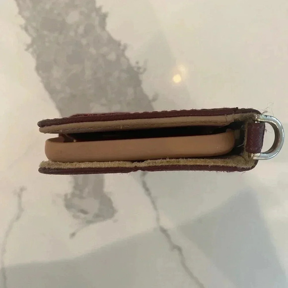 Michael Kors Phone Case/Wallet. Magnet snap close. 6” tall x 3.5” wide. Oxblood. - Picture 8 of 9